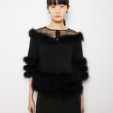 Discover the Purificación García Fur Coat – a 22-inch, size S vintage coat, crafted from angora blend with 100% duck feather details. In very good condition, modeled by someone 5'9" tall.