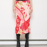 Discover the Angie Floral Skirt – a 30.5-inch, 100% rayon skirt in very good condition, offering a soft drape and flowy movement. Modeled by someone 5'9" tall.
