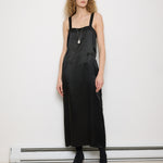 1920s Silk Black Dress, 54-inch length, 18-inch chest, 100% silk. Model is 5'11", very good vintage condition