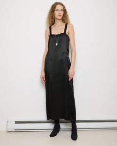 1920s Silk Black Dress, 54-inch length, 18-inch chest, 100% silk. Model is 5'11", very good vintage condition