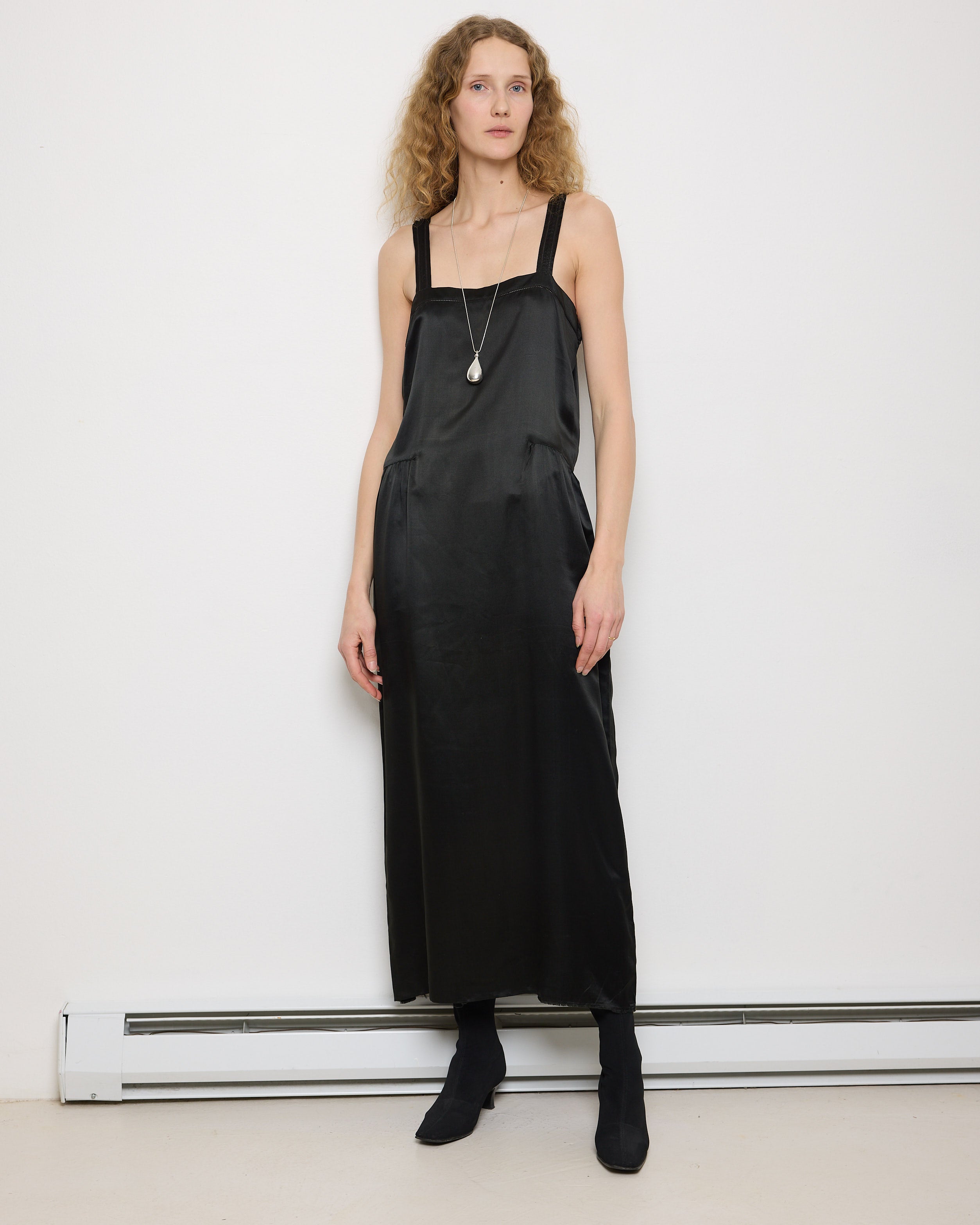 1920s Silk Black Dress, 54-inch length, 18-inch chest, 100% silk. Model is 5'11", very good vintage condition