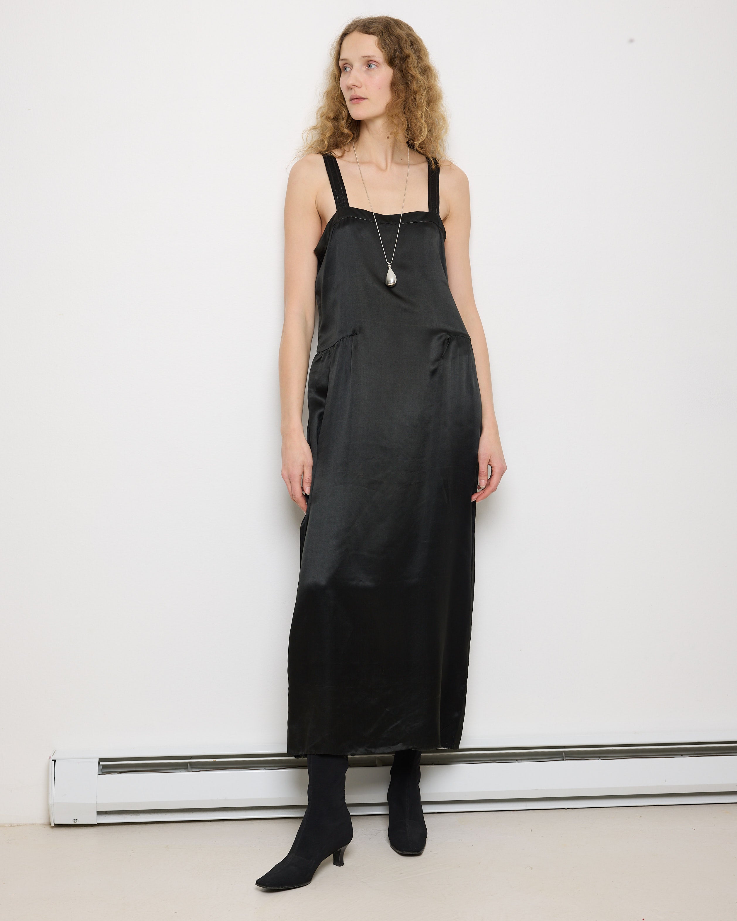 1920s Silk Black Dress, 54-inch length, 18-inch chest, 100% silk. Model is 5'11", very good vintage condition