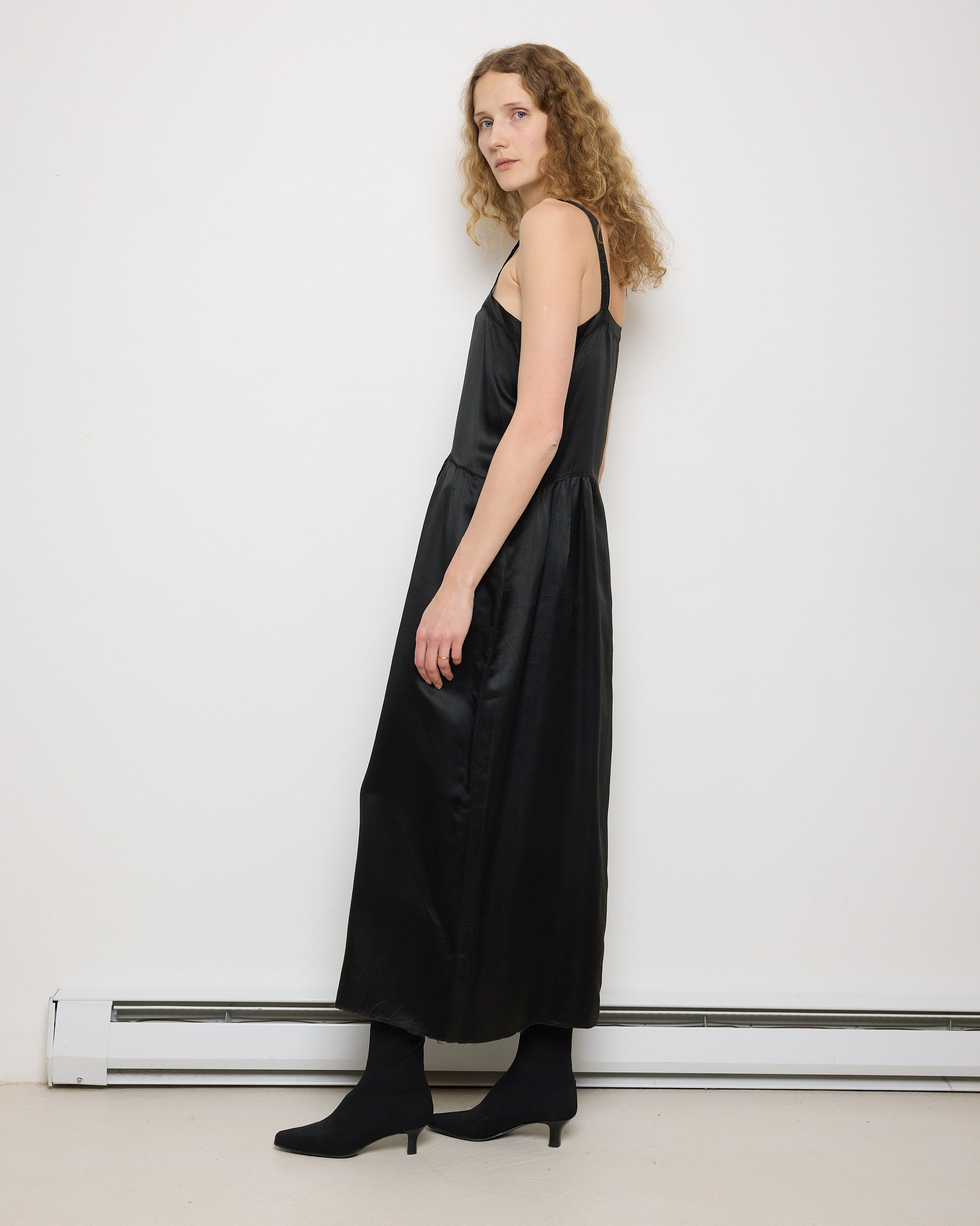 1920s Silk Black Dress, 54-inch length, 18-inch chest, 100% silk. Model is 5'11", very good vintage condition