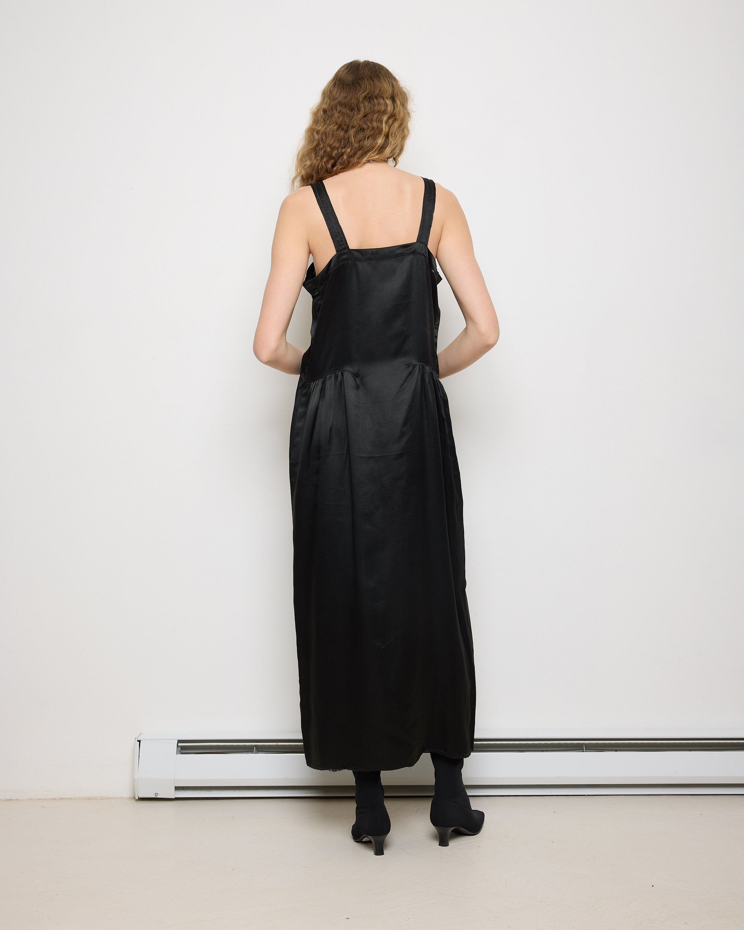 1920s Silk Black Dress, 54-inch length, 18-inch chest, 100% silk. Model is 5'11", very good vintage condition