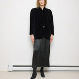 Black Quilted Velvet Blazer, size 12, 100% cotton, 28.5-inch length, 18-inch shoulders, 22-inch sleeves. Model is 5'11"