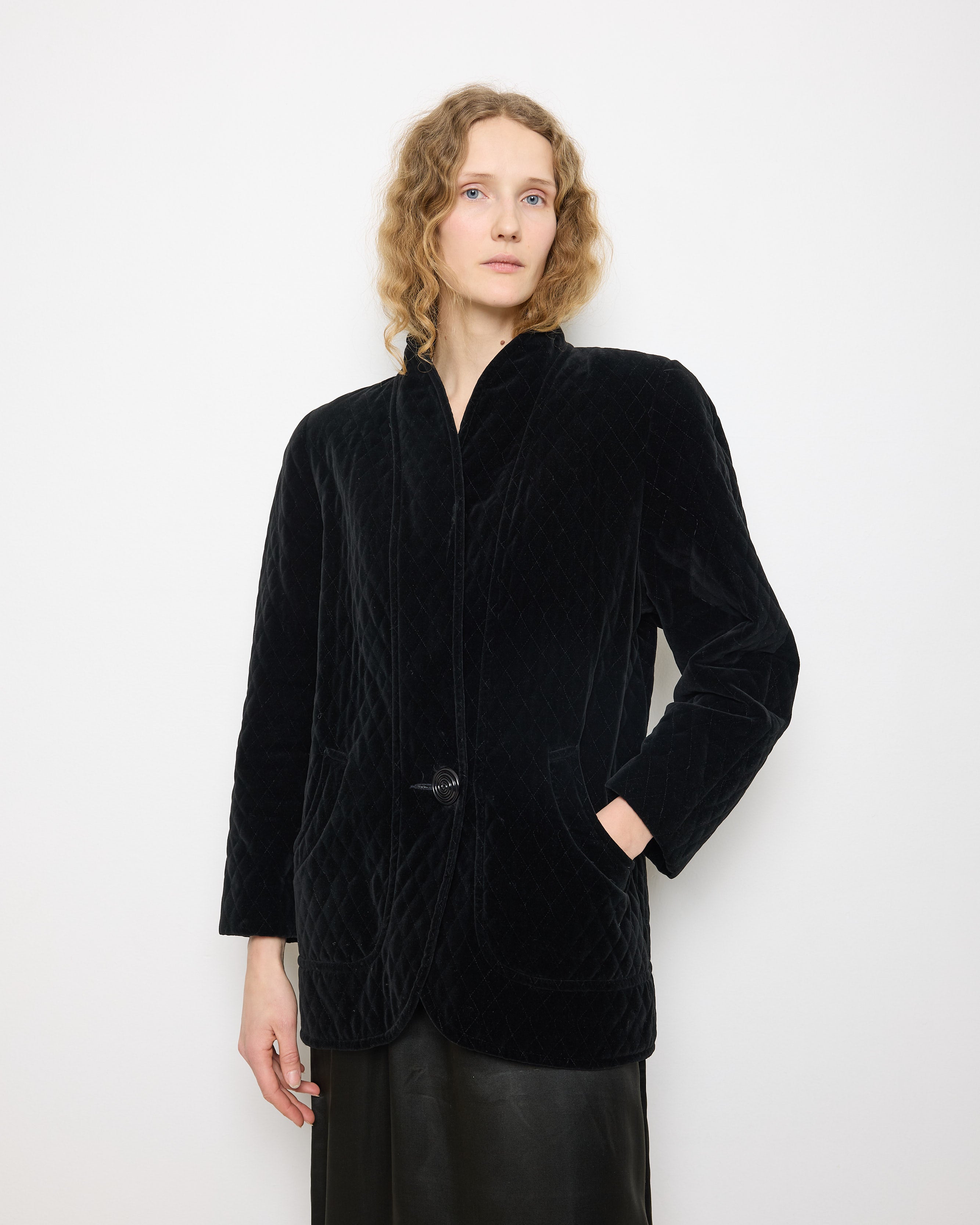 Black Quilted Velvet Blazer, size 12, 100% cotton, 28.5-inch length, 18-inch shoulders, 22-inch sleeves. Model is 5'11"