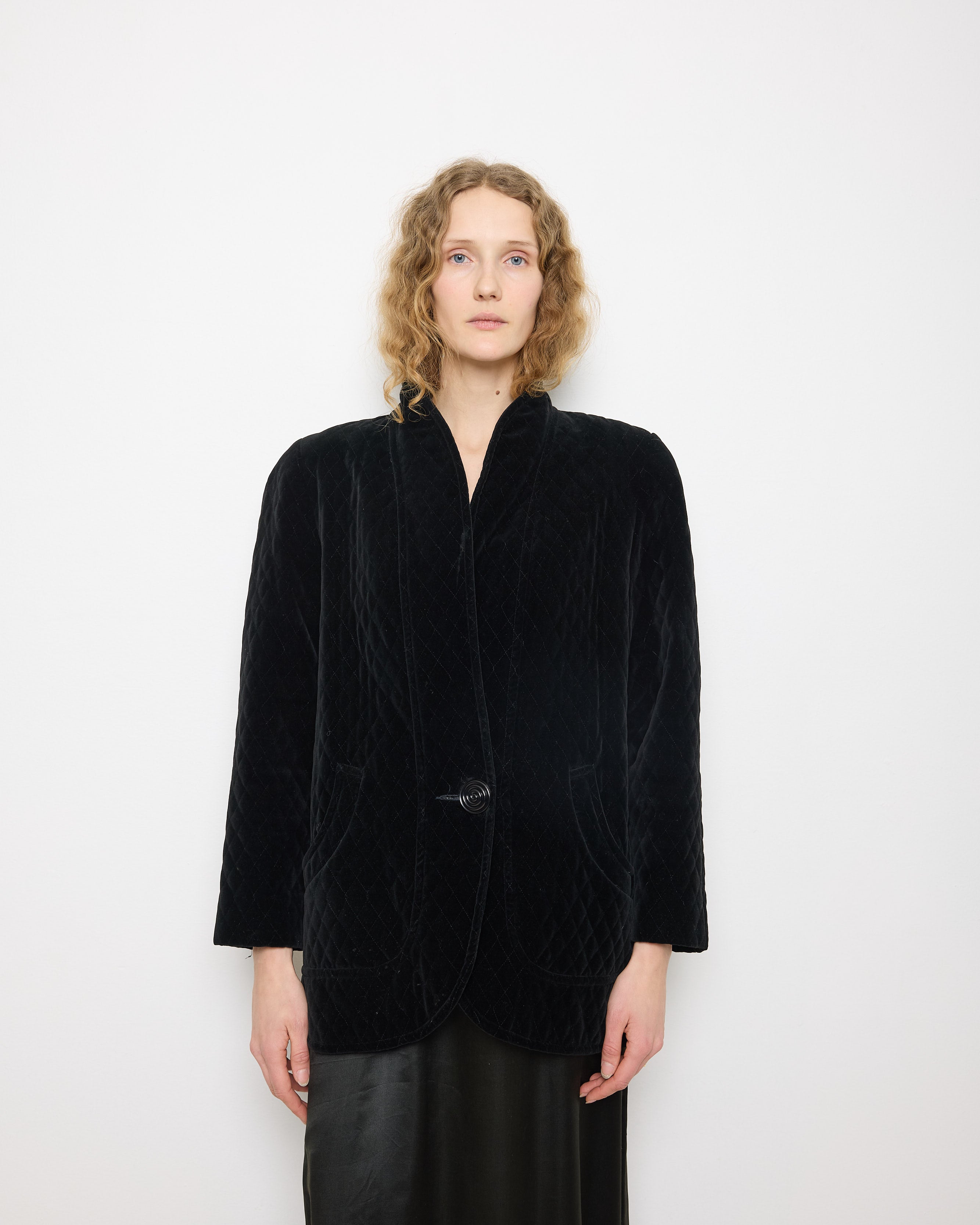 Black Quilted Velvet Blazer, size 12, 100% cotton, 28.5-inch length, 18-inch shoulders, 22-inch sleeves. Model is 5'11"