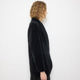 Black Quilted Velvet Blazer, size 12, 100% cotton, 28.5-inch length, 18-inch shoulders, 22-inch sleeves. Model is 5'11"