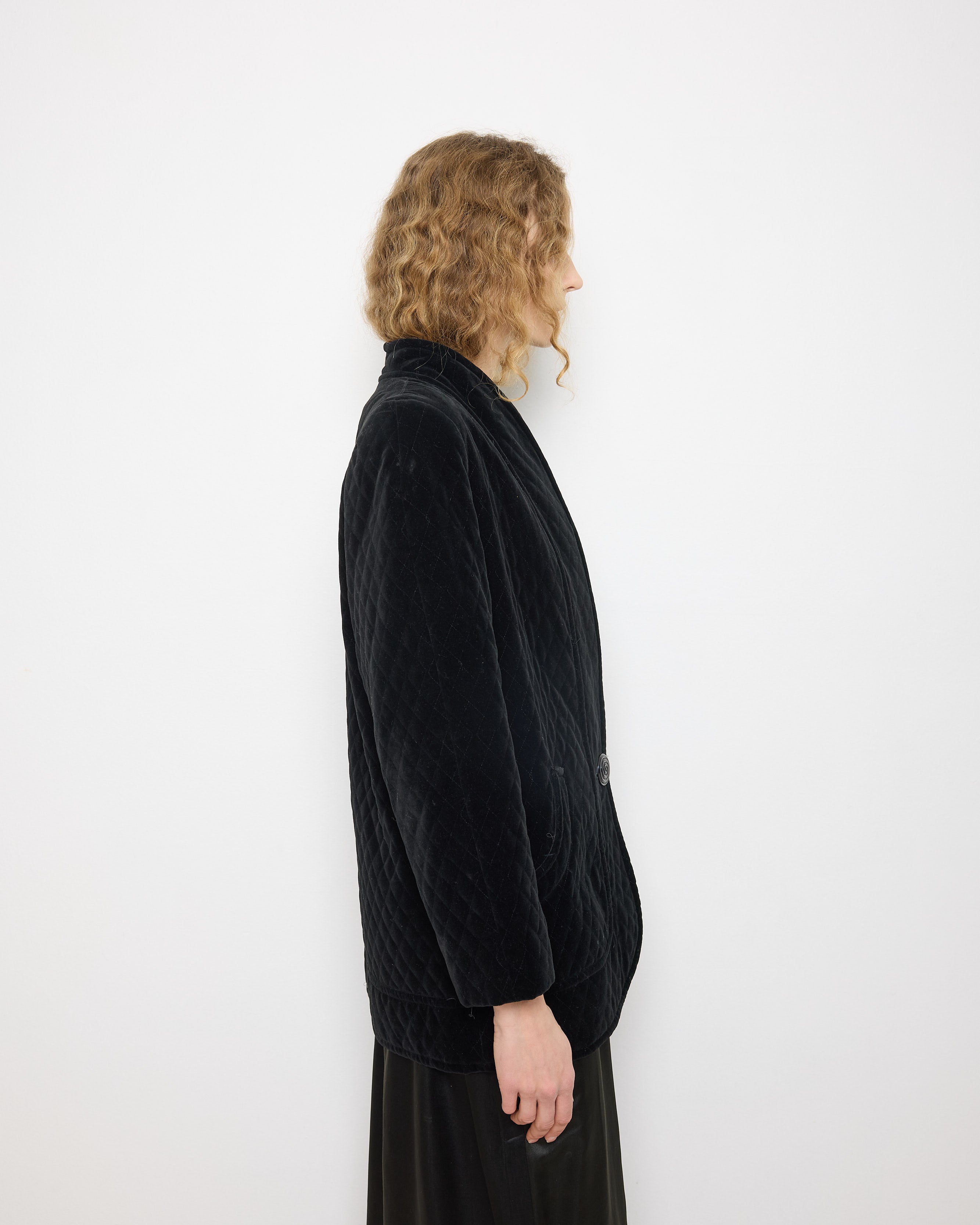 Black Quilted Velvet Blazer, size 12, 100% cotton, 28.5-inch length, 18-inch shoulders, 22-inch sleeves. Model is 5'11"