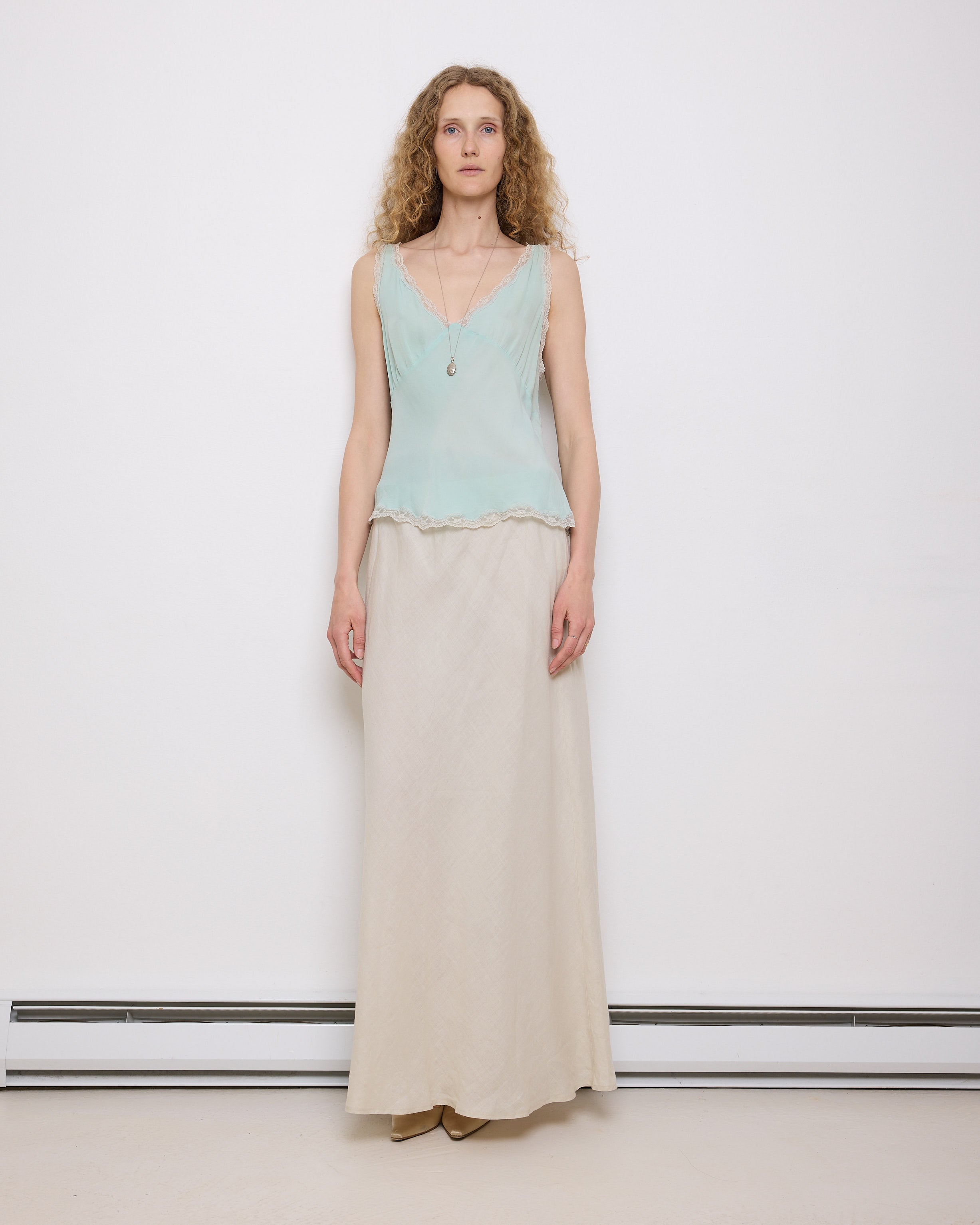 Green Silk Top, 23-inch length, suggested medium size. Model is 5'11", in good vintage condition
