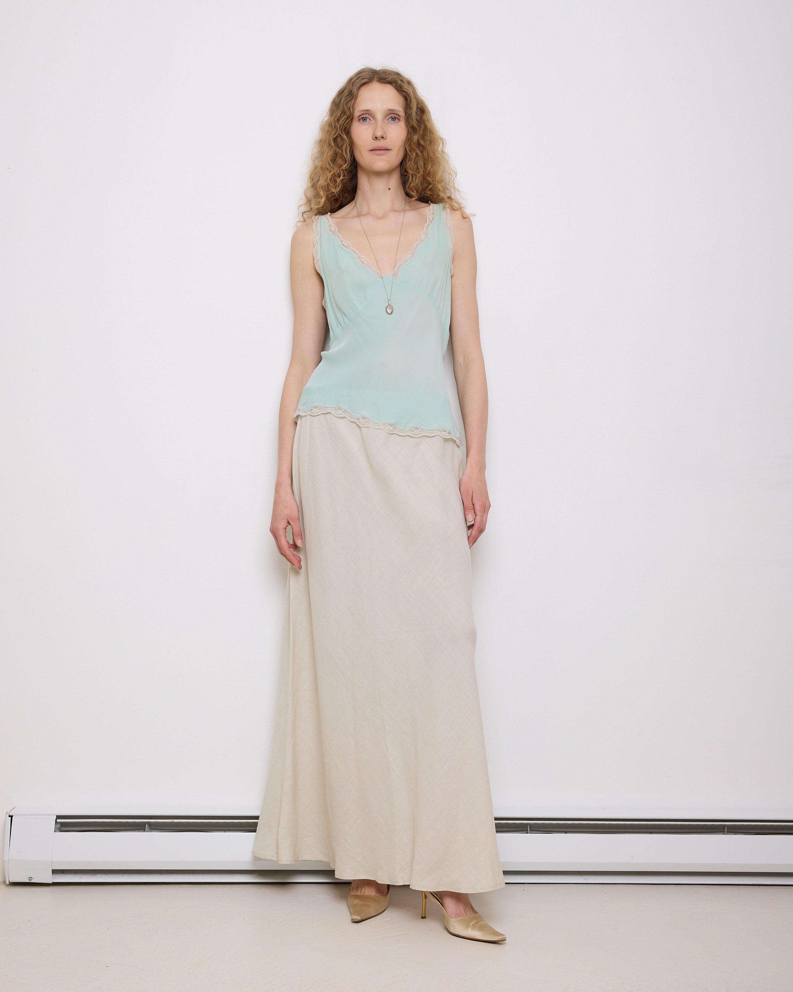 Vintage White Linen Skirt, 42-inch length, 16-inch waist, suggested size M/L. Model is 5'11"