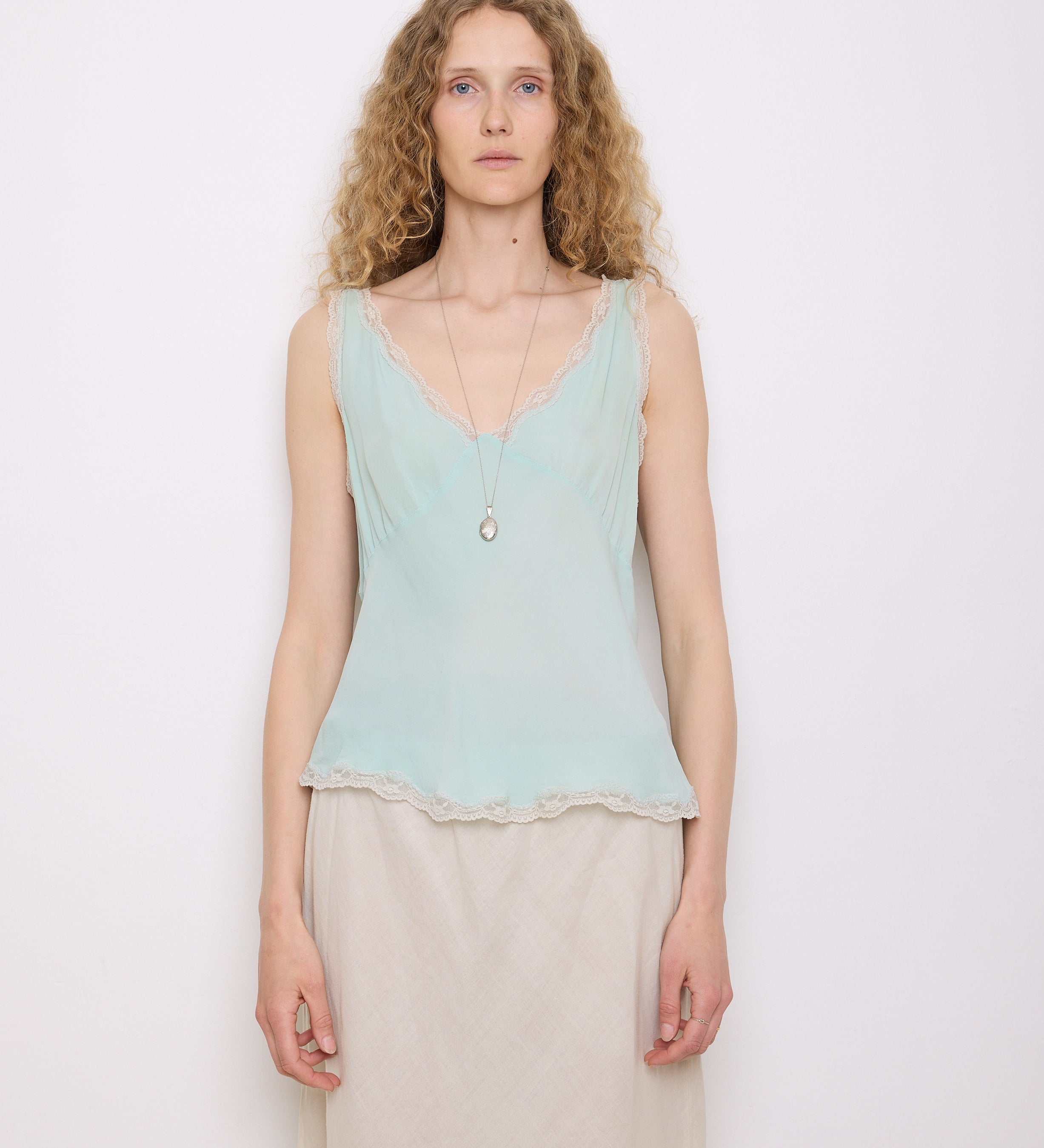 Green Silk Top, 23-inch length, suggested medium size. Model is 5'11", in good vintage condition