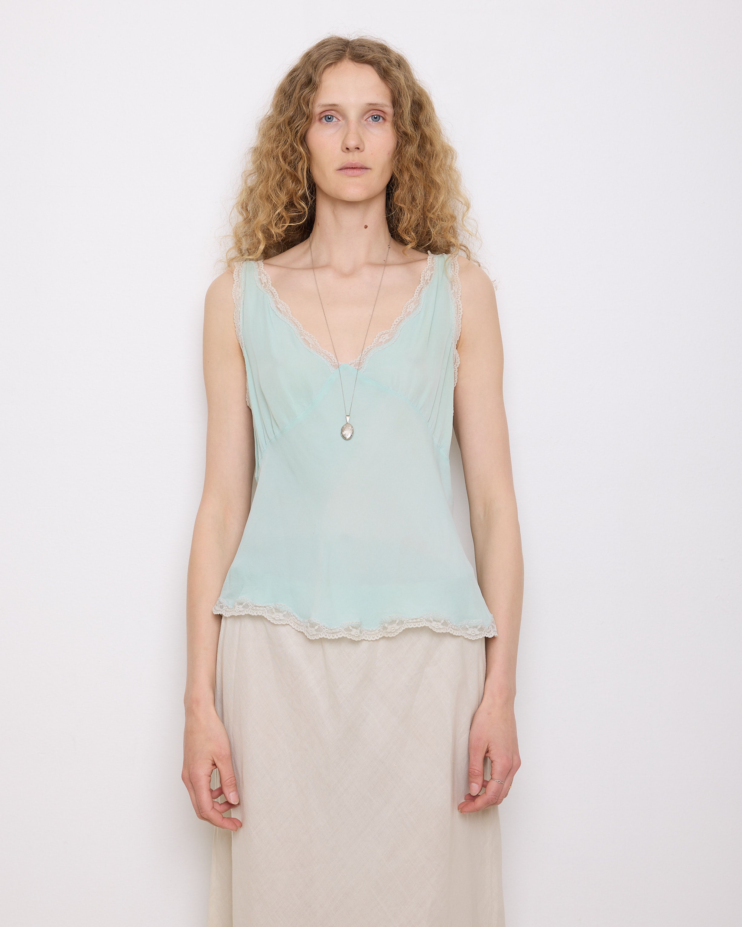 Green Silk Top, 23-inch length, suggested medium size. Model is 5'11", in good vintage condition