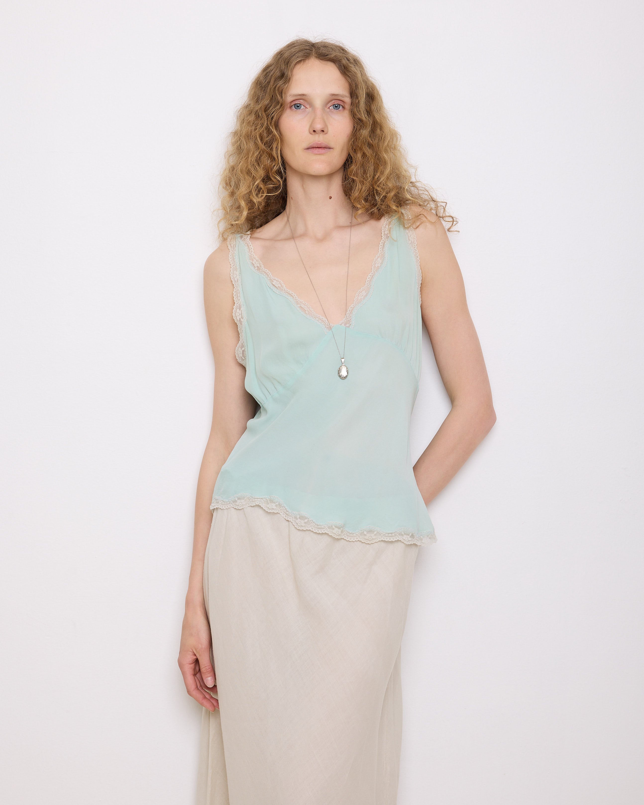 Green Silk Top, 23-inch length, suggested medium size. Model is 5'11", in good vintage condition