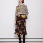 Brown leather shoulder bag with gold mesh details, 7x19 inches, 17-inch strap, multi-pocket design