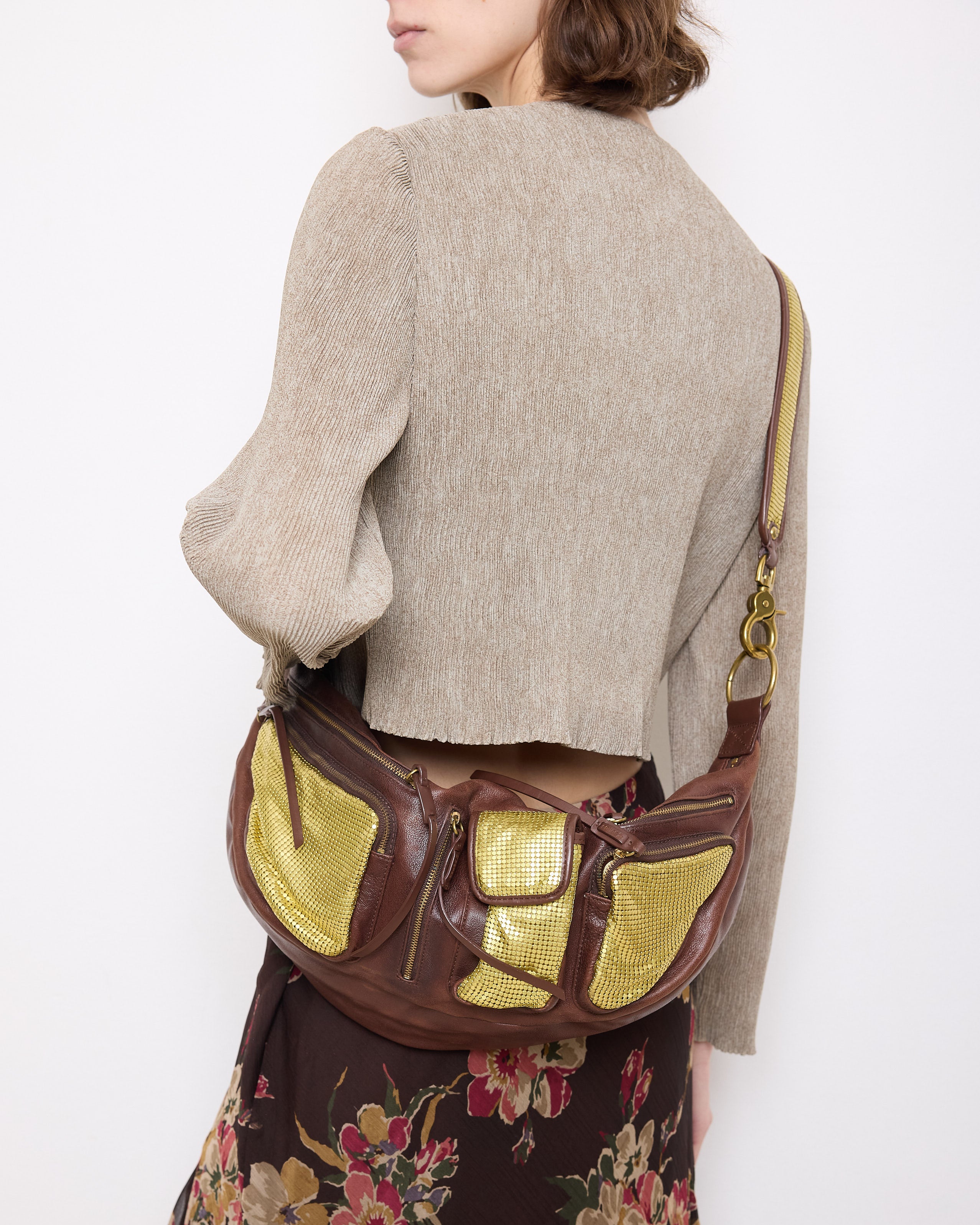 Brown leather shoulder bag with gold mesh details, 7x19 inches, 17-inch strap, multi-pocket design