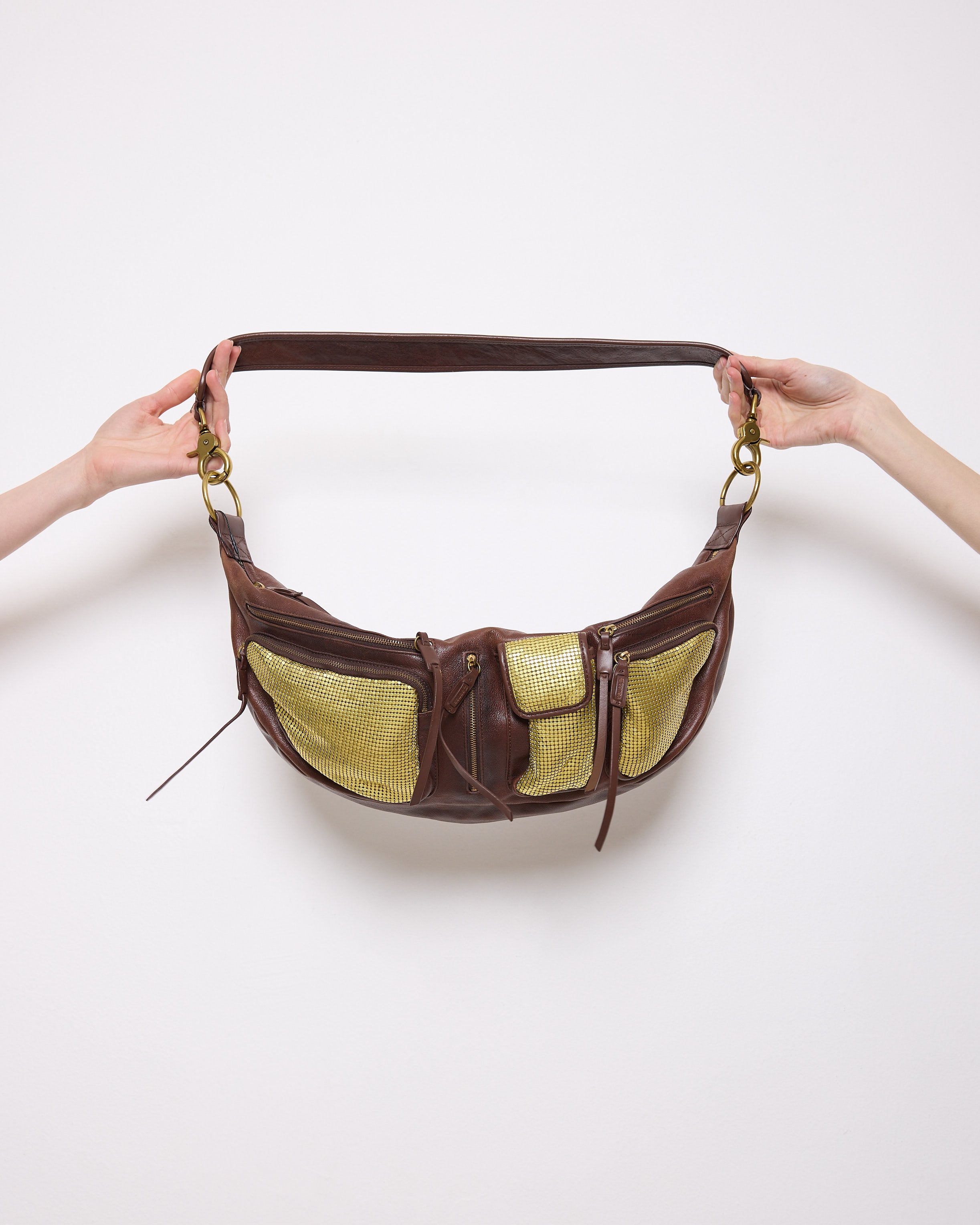 Brown leather shoulder bag with gold mesh details, 7x19 inches, 17-inch strap, multi-pocket design