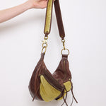 Brown leather shoulder bag with gold mesh details, 7x19 inches, 17-inch strap, multi-pocket design