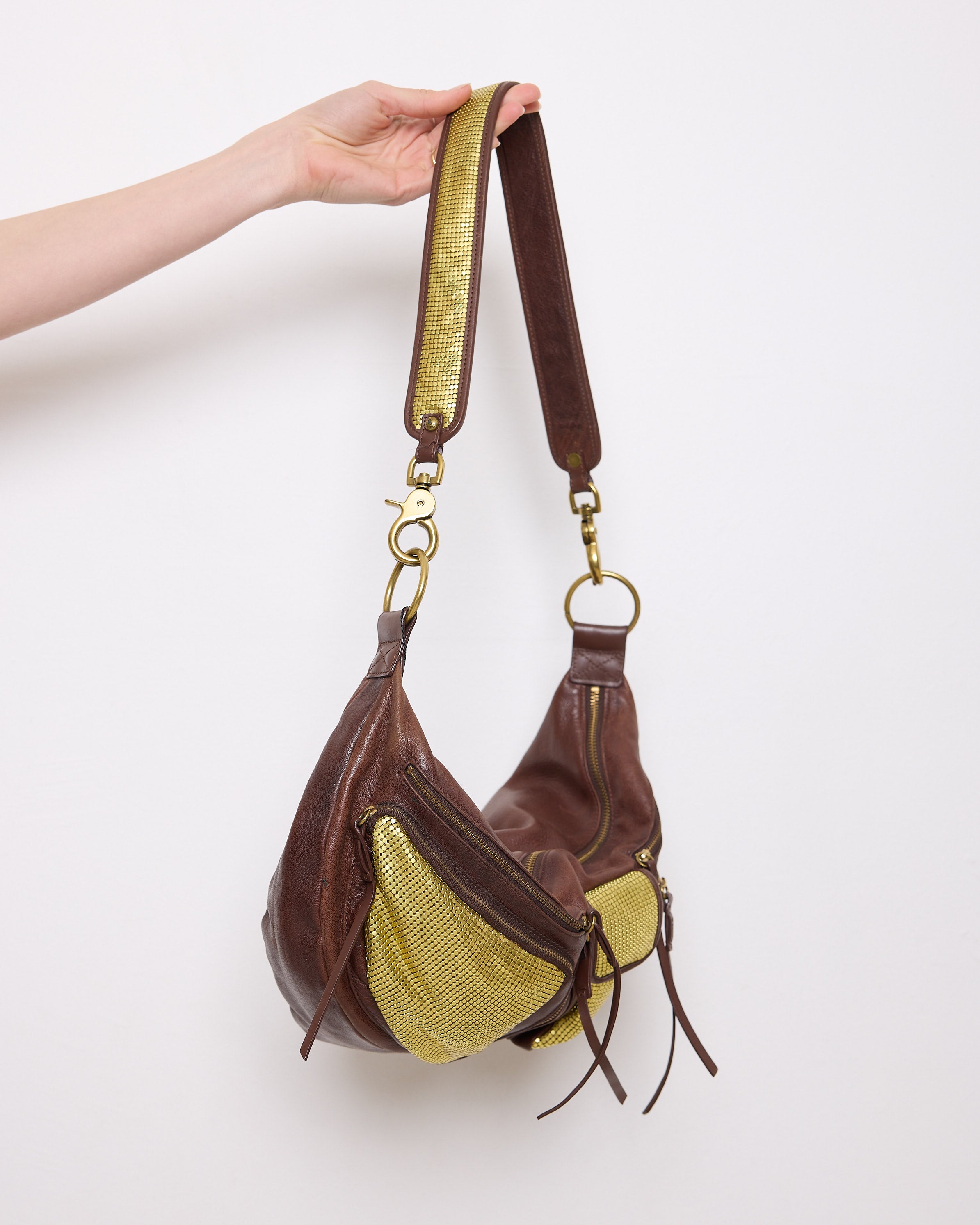 Brown leather shoulder bag with gold mesh details, 7x19 inches, 17-inch strap, multi-pocket design