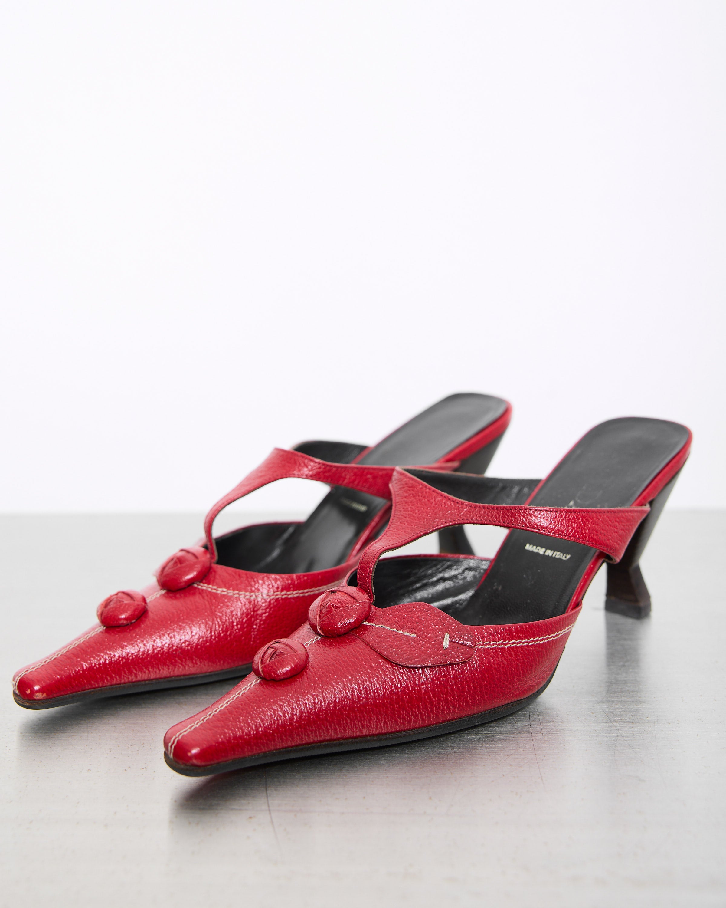 Prada Red Shoes in good condition with some signs of wear, size 38, featuring a timeless and elegant design