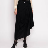 Discover the Asymmetrical Ann Demeulemeester Skirt – an ankle-length vintage masterpiece with sculptural asymmetric draping and a wrap design. With a 29-inch length, size 38 fit, and model at 5'11", embrace avant-garde vintage elegance