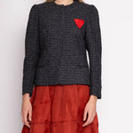 Discover the Ann Klein Ornamental Lapel Blazer – a vintage piece in mint condition crafted from pebbled grey tweed. Features a unique handkerchief detail, 25" length, 16" shoulder width, with model at 5'11". Embrace timeless elegance with this statement blazer