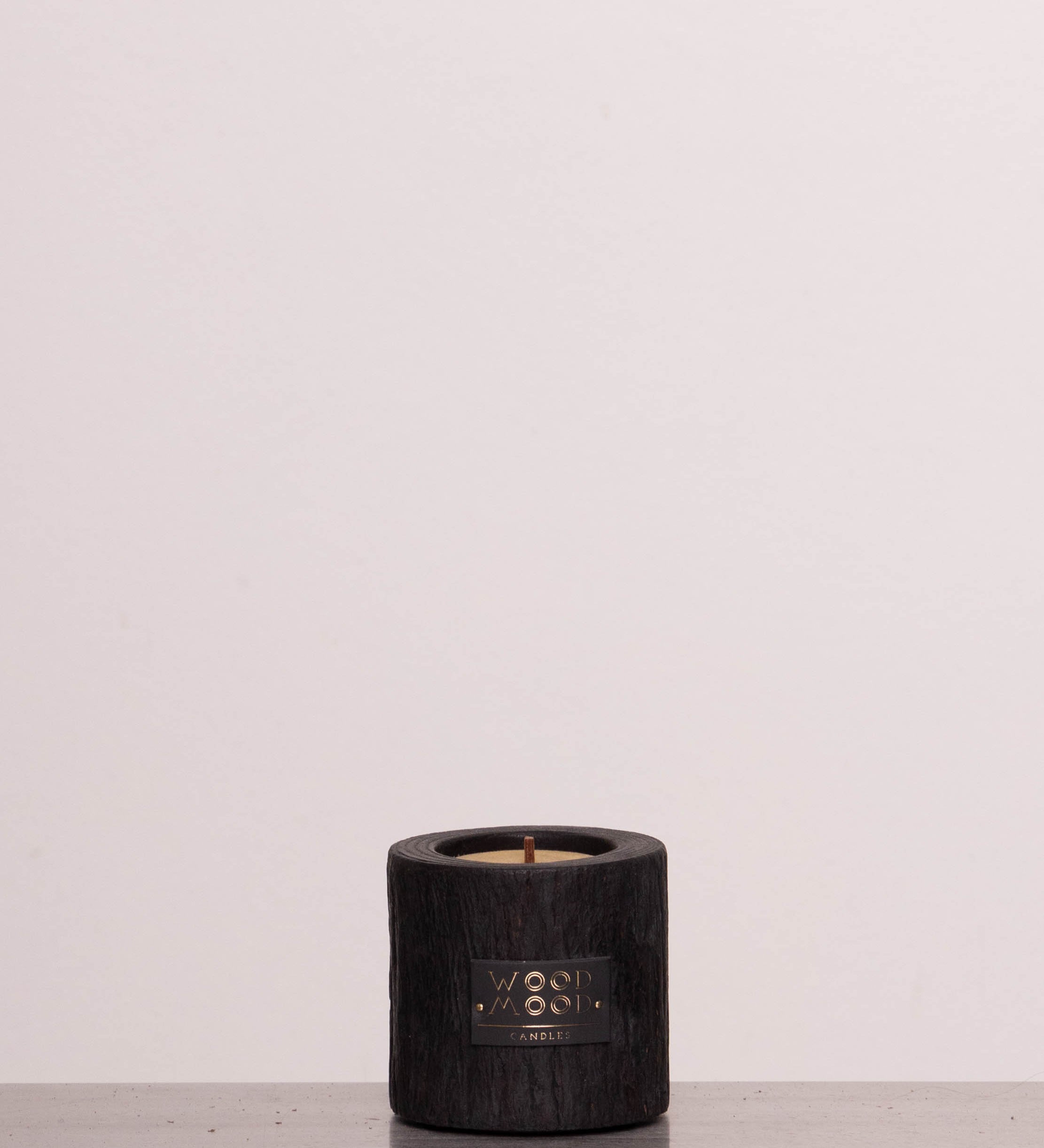 Discover the WOODMOOD Volcano Compact Spearmint Candle – a handcrafted wooden candle, 3.35" tall, with natural beeswax, cork base, and a refreshing spearmint scent.