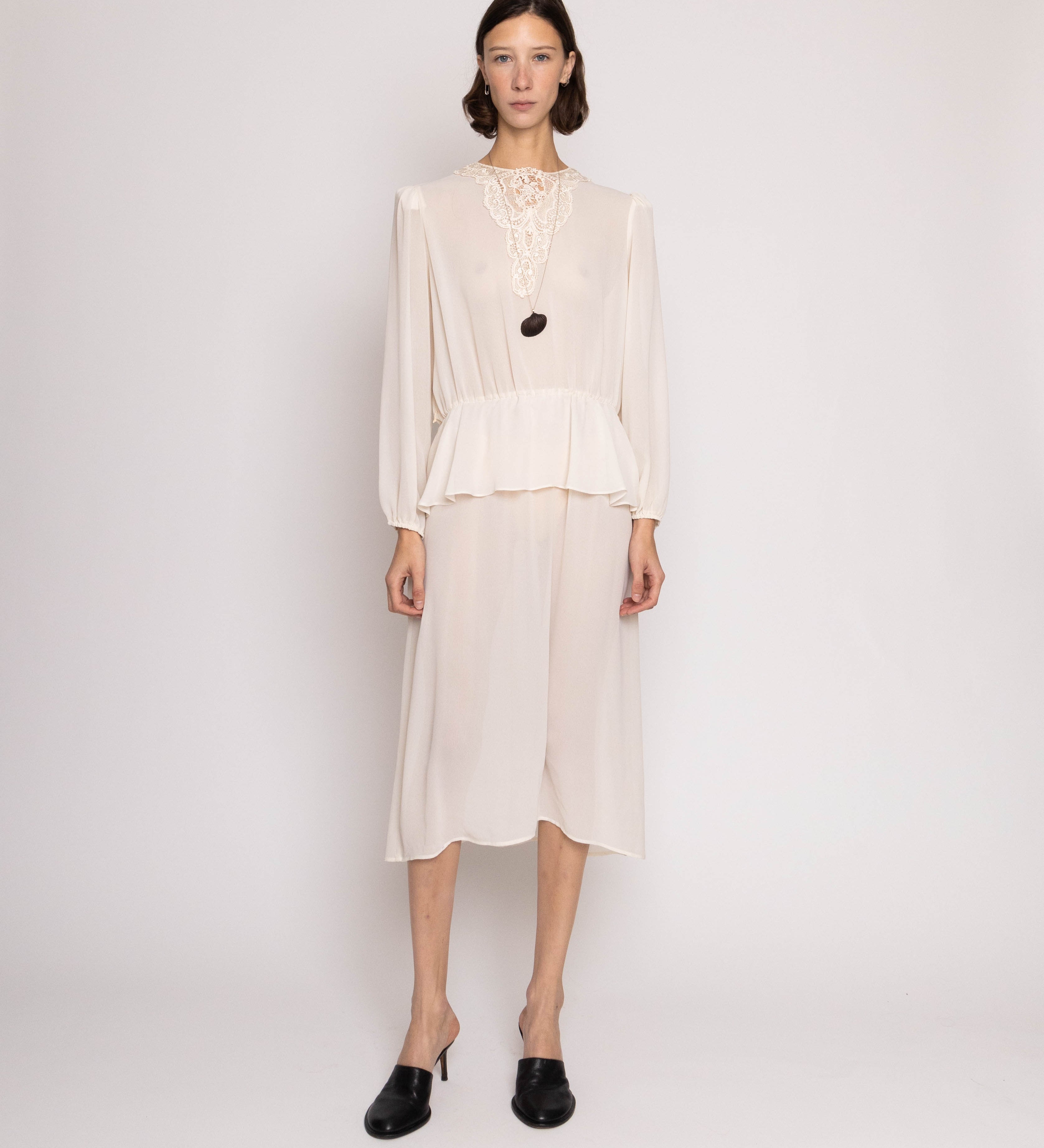 Discover the Robin Joy Semi Opaque Dress with Lace Appliqué – a 46.5-inch vintage dress with semi-opaque fabric and delicate lace details. In great condition. 15-inch waist for a flattering fit.