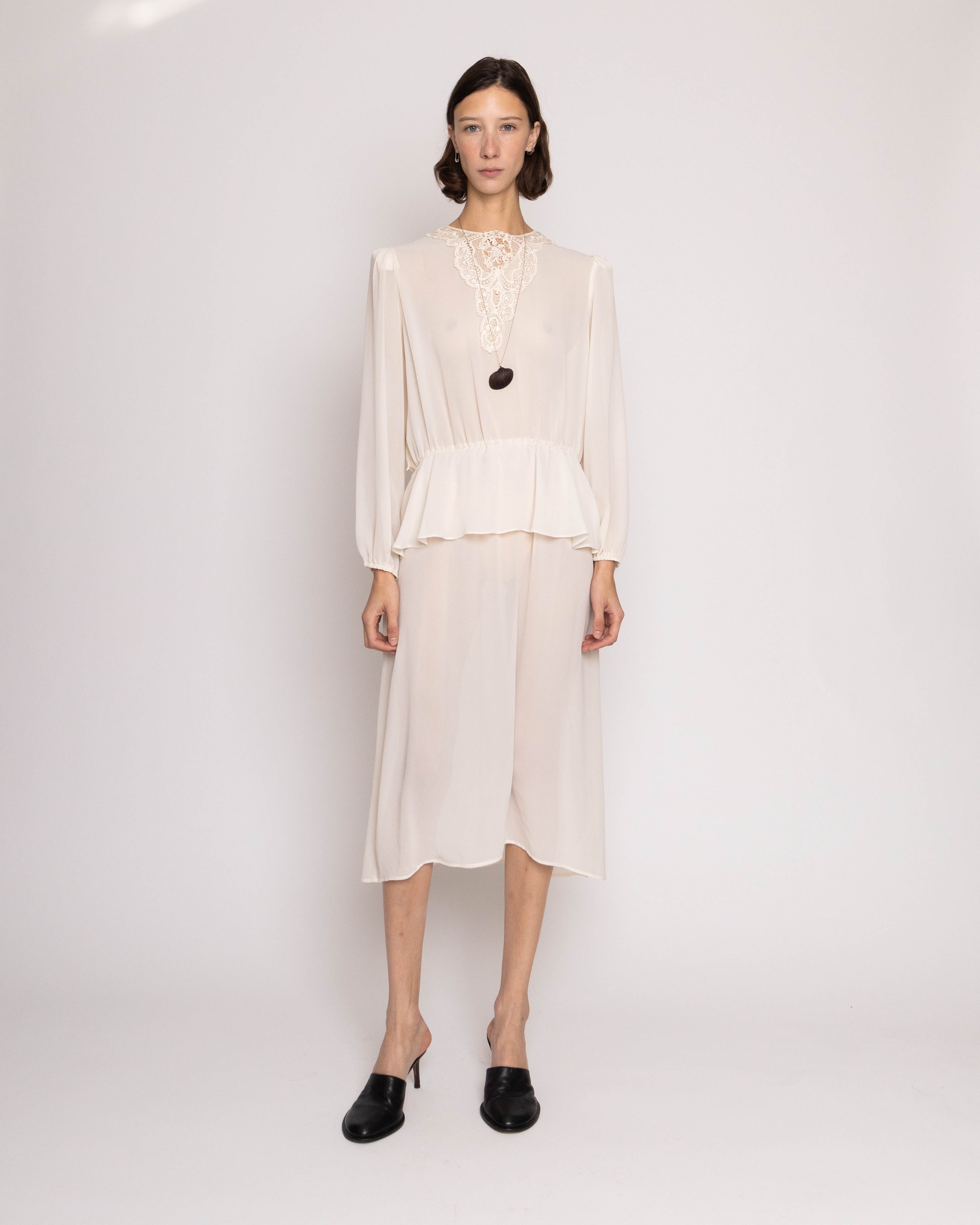 Discover the Robin Joy Semi Opaque Dress with Lace Appliqué – a 46.5-inch vintage dress with semi-opaque fabric and delicate lace details. In great condition. 15-inch waist for a flattering fit.